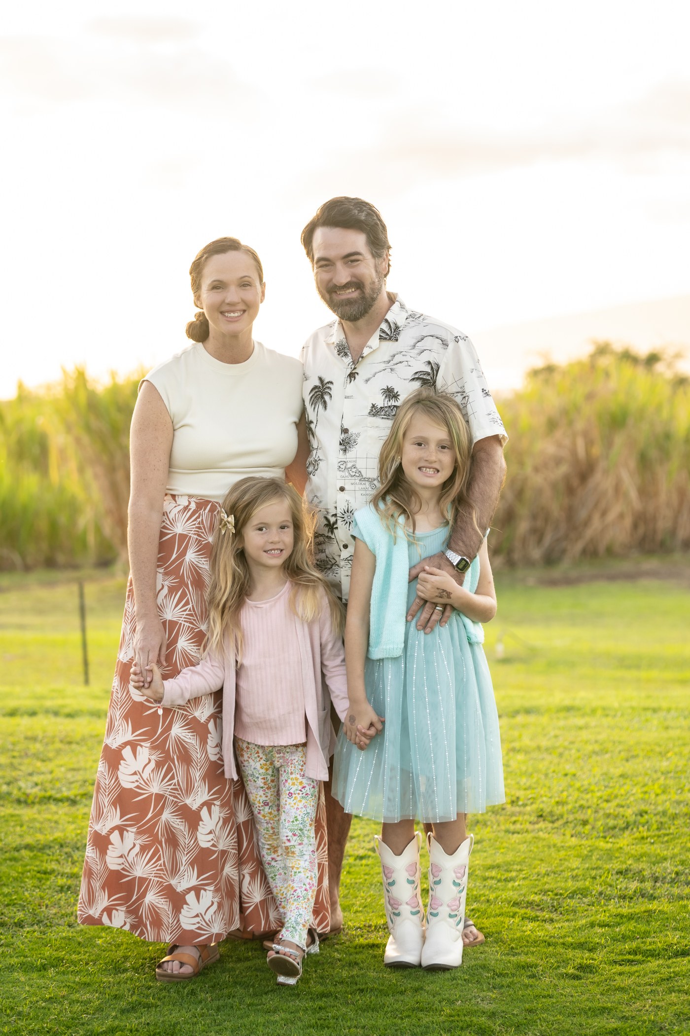 Gabriel Rao with his wife and their two children, standing together outdoors in Maui